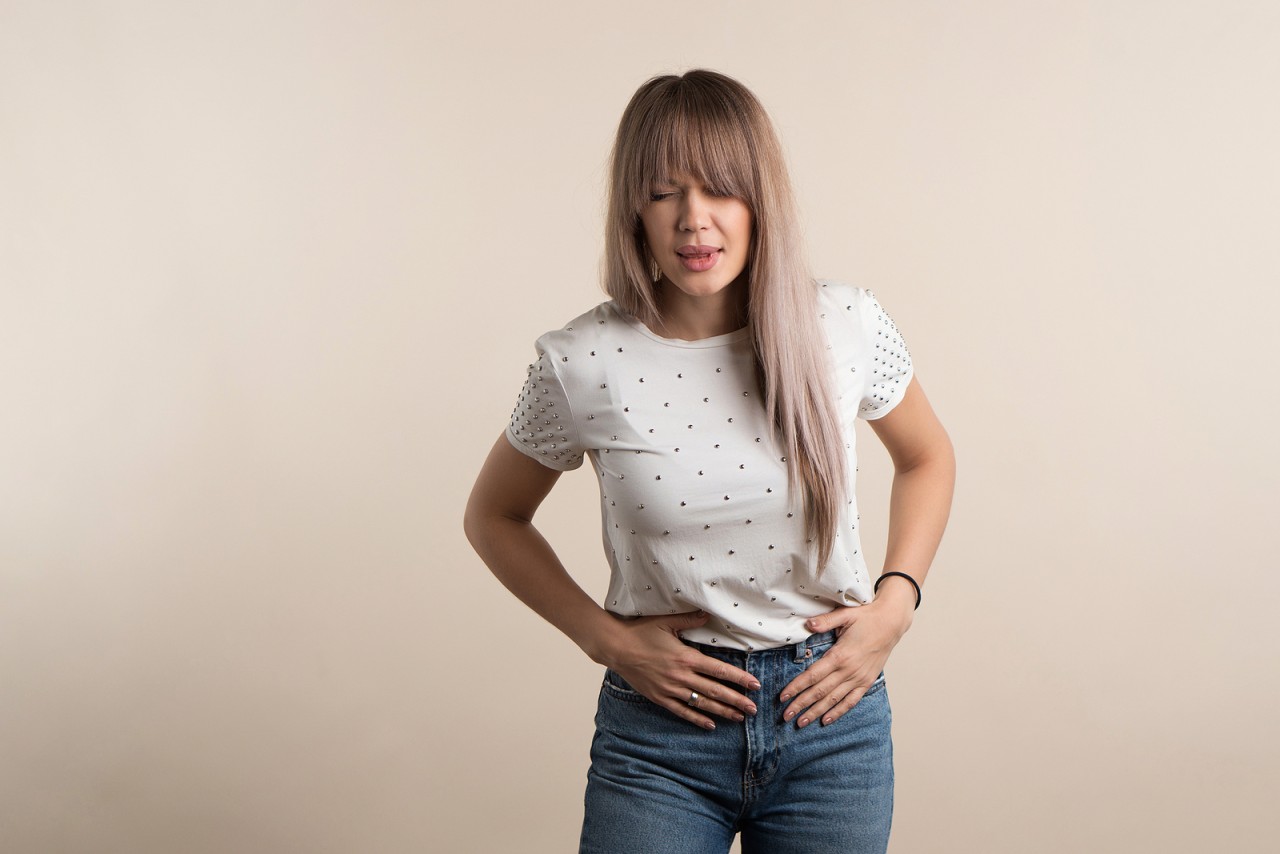 bigstock-Upset-Young-Woman-Keeps-Hands--445053203